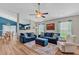 Spacious living room features modern furnishings and connects to the dining area, ideal for entertaining at 173 Southport Dr, Summerville, SC 29483