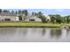 Scenic view of the pond behind the property with reflections of the trees and sky creating a tranquil setting at 173 Southport Dr, Summerville, SC 29483