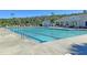 Large swimming pool with multiple lap lanes, lounge chairs and a pool house for community enjoyment at 173 Southport Dr, Summerville, SC 29483