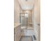 Modern bathroom showcasing a glass-enclosed shower with seating and light stone accents, plus updated fixtures at 183 Civitas St, Mount Pleasant, SC 29464