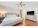 Bedroom with hardwood floors, ceiling fan, dresser, and TV at 183 Civitas St, Mount Pleasant, SC 29464