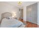 Bedroom with hardwood floors, chandelier, and double closet at 183 Civitas St, Mount Pleasant, SC 29464