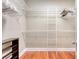 Walk-in closet with white wire shelving and hardwood floors at 183 Civitas St, Mount Pleasant, SC 29464