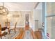 Elegant dining room with hardwood floors, stylish light fixture, and a view through to a bright, well-lit space at 183 Civitas St, Mount Pleasant, SC 29464