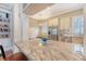 Bright kitchen features granite countertops, stainless appliances, and built-in shelving for a modern and functional design at 183 Civitas St, Mount Pleasant, SC 29464