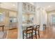 Charming kitchen featuring barstool seating and open views into the kitchen and hallway areas at 183 Civitas St, Mount Pleasant, SC 29464