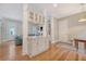 Elegant kitchen featuring a breakfast bar, seamlessly connected to the living room and entryway at 183 Civitas St, Mount Pleasant, SC 29464
