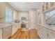 Well-lit kitchen with stainless steel appliances, custom cabinetry, and granite countertops, ideal for cooking at 183 Civitas St, Mount Pleasant, SC 29464