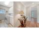 Bright laundry room with a modern washer and dryer, ample counter space, and convenient access to the hallway at 183 Civitas St, Mount Pleasant, SC 29464