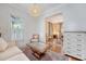 Comfortable living area with couch, hardwood floors, and a view into the elegant dining room, great for entertaining at 183 Civitas St, Mount Pleasant, SC 29464