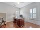 Bright office with hardwood floors, desk, chair, and plantation shutters at 183 Civitas St, Mount Pleasant, SC 29464