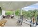 Large porch with rocking chairs, seating, and views of mature trees at 183 Civitas St, Mount Pleasant, SC 29464