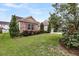 Charming home with stone accents, manicured lawn, and mature evergreens enhancing its curb appeal at 193 Cypress Forest Dr, Moncks Corner, SC 29461