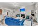Large open-concept living room featuring a fireplace, neutral walls, and hardwood floors at 193 Cypress Forest Dr, Moncks Corner, SC 29461