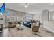 Bright, open-concept living room with large windows, comfortable seating, and hardwood floors at 193 Cypress Forest Dr, Moncks Corner, SC 29461