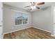 Bedroom with hardwood floors, a neutral color scheme, and a large window with blinds at 2005 Isabela Ct, Summerville, SC 29483