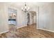 Dining room with hardwood flooring, chandelier lighting, and arched entryway at 2005 Isabela Ct, Summerville, SC 29483