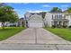 Charming two-story home with a driveway and lawn at 2005 Isabela Ct, Summerville, SC 29483