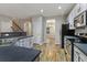 Well-lit kitchen with stainless steel appliances and neutral-colored cabinetry at 2005 Isabela Ct, Summerville, SC 29483