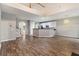 Bright living room featuring hardwood floors and a kitchen with white cabinetry at 2005 Isabela Ct, Summerville, SC 29483