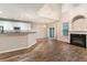 Living area showcases luxury flooring, vaulted ceiling, and a fireplace with an arched alcove at 2005 Isabela Ct, Summerville, SC 29483