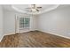 Bedroom featuring hardwood floors, a ceiling fan, and a window offering plenty of natural light at 2005 Isabela Ct, Summerville, SC 29483