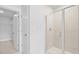 Tiled shower and open closet space in a bright bathroom at 201 Terrace View Dr, Summerville, SC 29486