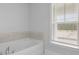 Bathroom featuring soaking tub and a bright window at 201 Terrace View Dr, Summerville, SC 29486