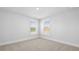 Sunny bedroom with carpet, white walls, and two windows at 201 Terrace View Dr, Summerville, SC 29486