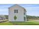 Charming home with bright white siding, green lawn, and a cute newly planted tree at 201 Terrace View Dr, Summerville, SC 29486