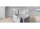 Bright kitchen featuring stainless steel appliances, a center island with a sink, and light wood flooring at 201 Terrace View Dr, Summerville, SC 29486