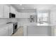 Bright, modern kitchen with stainless steel appliances, white cabinetry, and a center island at 201 Terrace View Dr, Summerville, SC 29486