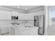 The kitchen features a stainless steel fridge, a center island, and lots of white cabinets at 201 Terrace View Dr, Summerville, SC 29486