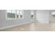 Bright living room with a large window, a glass door, and light-colored wood flooring at 201 Terrace View Dr, Summerville, SC 29486