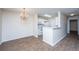 Dining area with chandelier, adjacent to the kitchen with white appliances at 2011 N Highway 17 # 1400B, Mount Pleasant, SC 29466