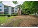 Exterior of condo building showcasing multiple balconies and mature landscaping at 2011 N Highway 17 # 1400B, Mount Pleasant, SC 29466