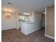 Bright kitchen featuring white appliances and cabinets, open to the dining area with a chandelier at 2011 N Highway 17 # 1400B, Mount Pleasant, SC 29466