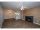 Living room with fireplace, wood-look floors, and open to dining and kitchen area at 2011 N Highway 17 # 1400B, Mount Pleasant, SC 29466