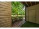 View from screened patio to green landscape with palm trees at this lovely home at 2011 N Highway 17 # 1400B, Mount Pleasant, SC 29466