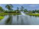 Picturesque community pond features a fountain, lush greenery, and serene views, enhancing the neighborhood's charm at 2011 N Highway 17 # 1400B, Mount Pleasant, SC 29466