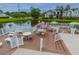 Inviting pool deck with seating, tables, and a scenic pond view at 2011 N Highway 17 # 1400B, Mount Pleasant, SC 29466