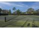 Well-maintained outdoor tennis court with green surface and surrounding fence for active community recreation at 2011 N Highway 17 # 1400B, Mount Pleasant, SC 29466