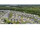 Aerial view of a community featuring modern homes, trees, and a pond at 215 Cypress Plantation Rd, Moncks Corner, SC 29461
