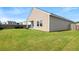 Large fenced backyard with lush green grass and ample space for outdoor activities at 215 Cypress Plantation Rd, Moncks Corner, SC 29461