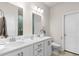 Bathroom featuring dual sink vanity with white cabinets and modern fixtures at 215 Cypress Plantation Rd, Moncks Corner, SC 29461