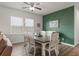 Charming dining area with a stylish green accent wall and a rustic wooden table at 215 Cypress Plantation Rd, Moncks Corner, SC 29461