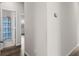 Hallway with neutral walls leads to bathroom and bedroom with natural light shining through window at 215 Cypress Plantation Rd, Moncks Corner, SC 29461