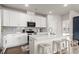 Modern kitchen with white cabinets, stainless steel appliances, and a large island at 215 Cypress Plantation Rd, Moncks Corner, SC 29461
