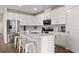 Contemporary kitchen featuring white cabinets, stainless appliances and a large kitchen island at 215 Cypress Plantation Rd, Moncks Corner, SC 29461
