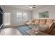 Cozy living room with a comfortable sectional sofa, complemented by natural light at 215 Cypress Plantation Rd, Moncks Corner, SC 29461